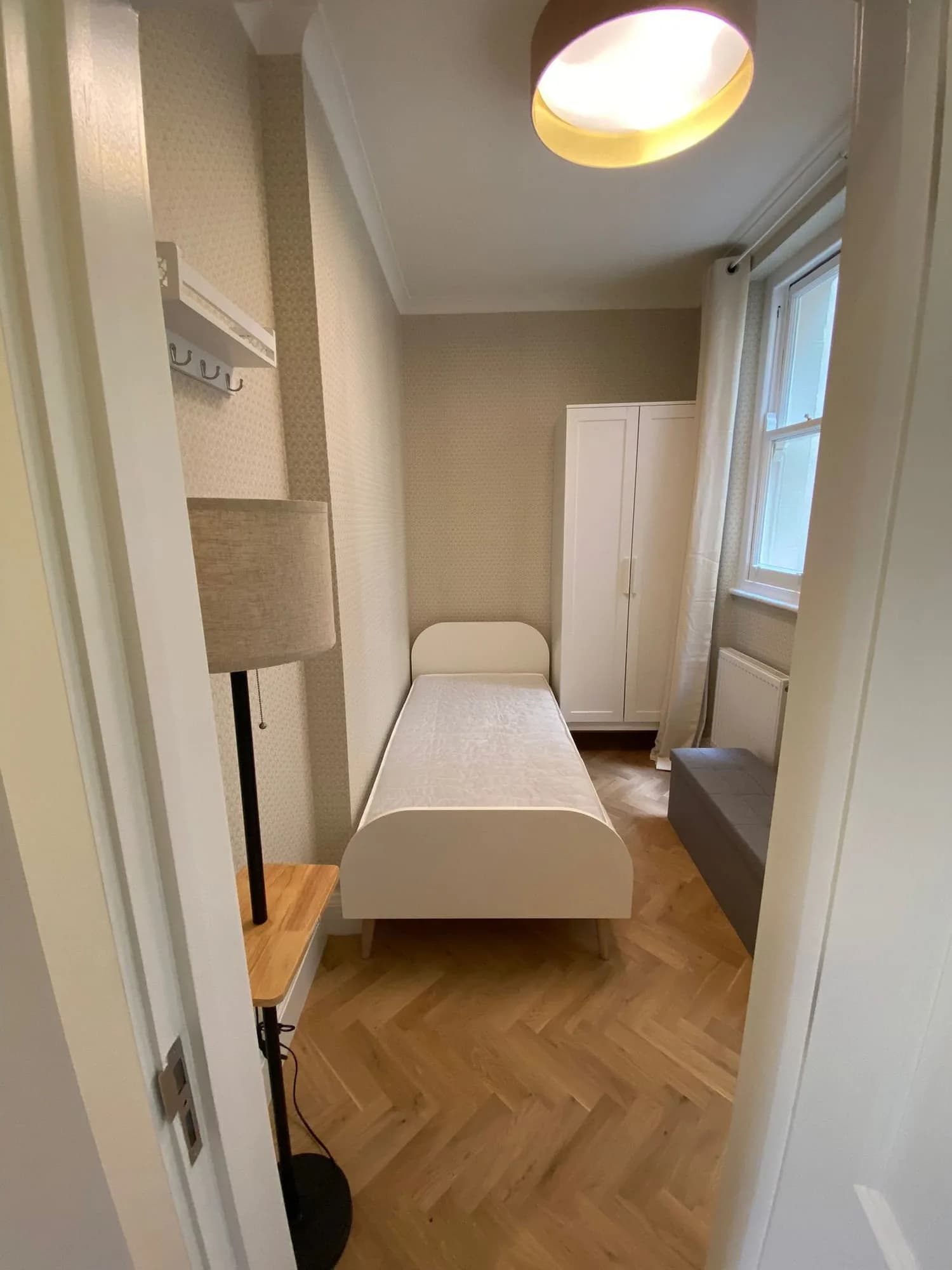 Chelsea I: single bedroom with fitted wardrobes and a herringbone floor