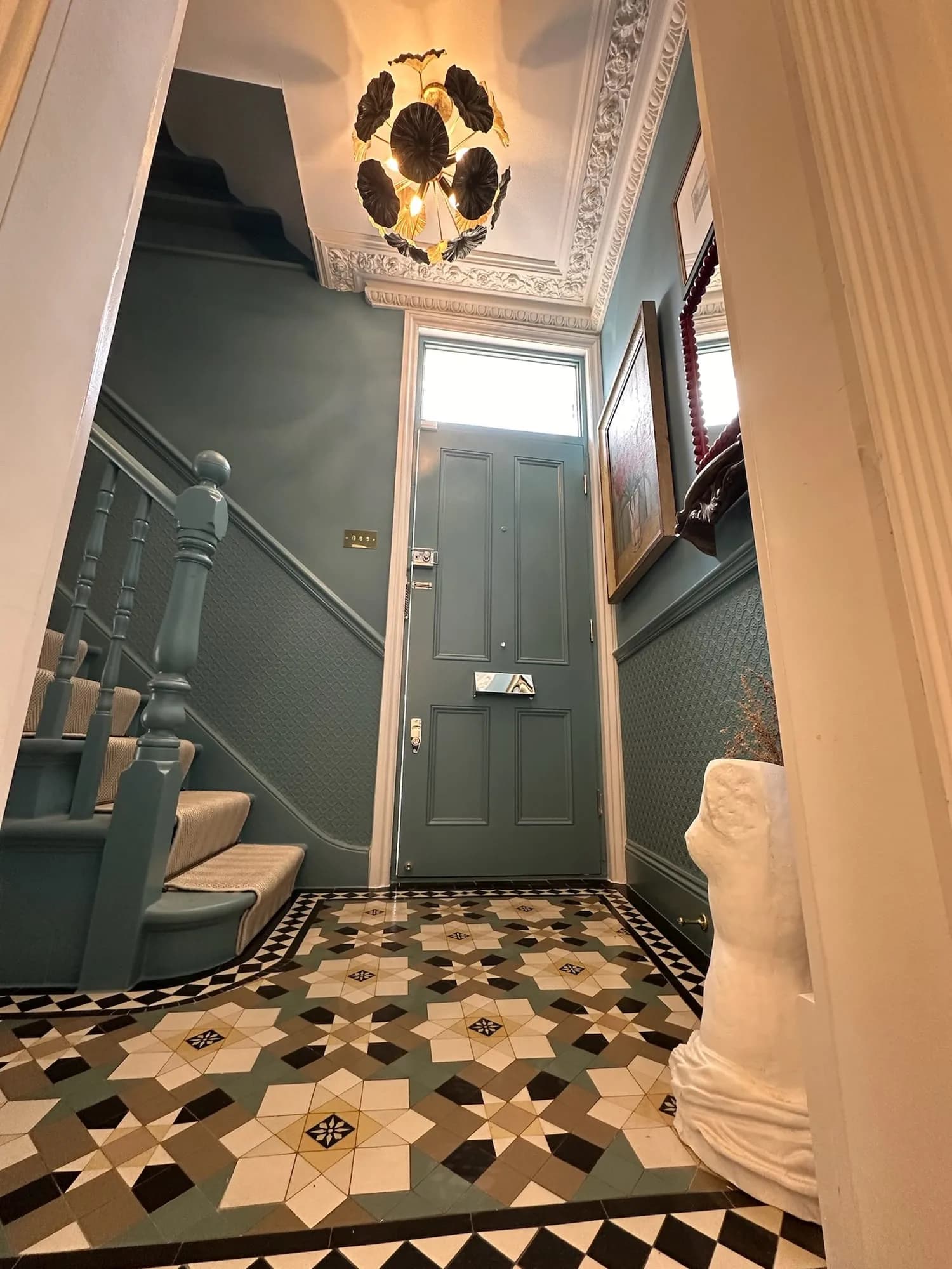 Earls Court I: entrance hall with a Victorian geometric tiled floor and panelled walls