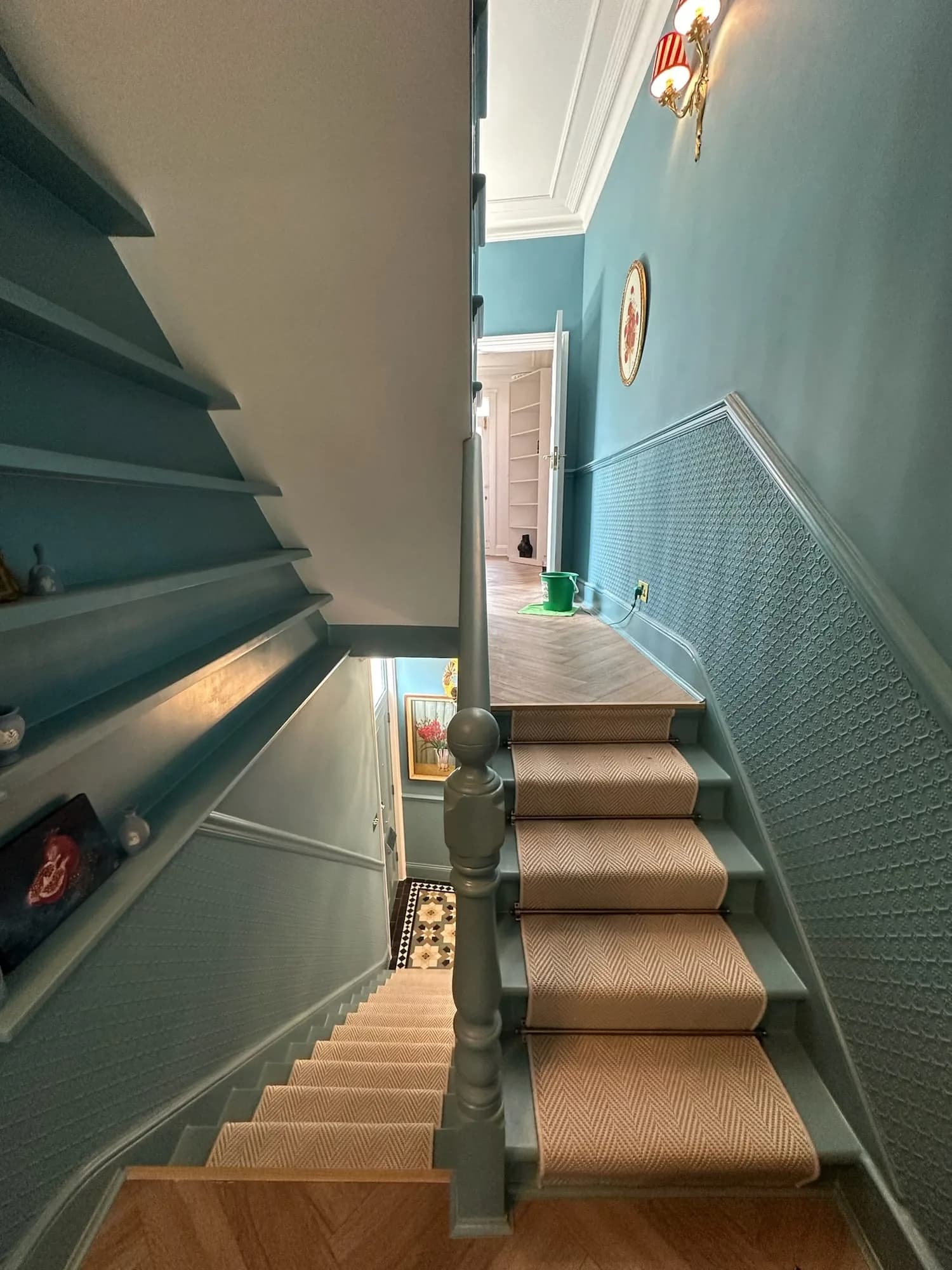 Earls Court I: staircase with a striped runner and soft blue panelled walls