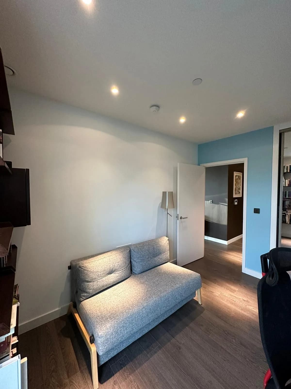 Finsbury Park: study corner with a grey sofa bed and built-in shelving