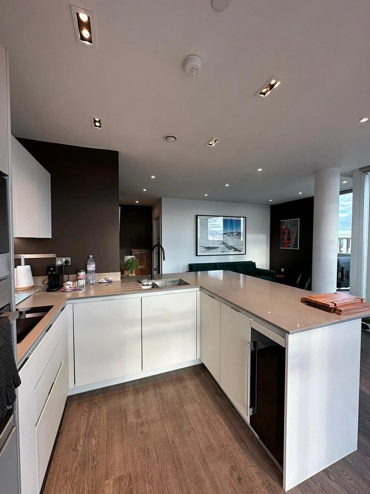 Finsbury Park: kitchen with white gloss units, stone worktops and recessed lighting